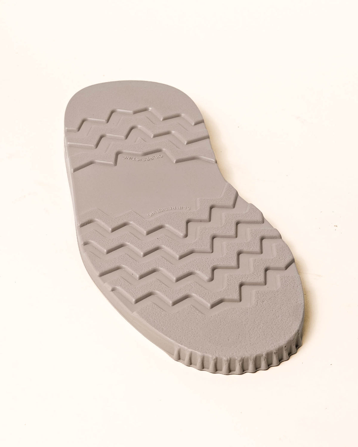 White wedge with tread showing with white background.